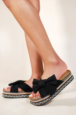 MADILYNN ESPADRILLE SLIDERS WITH CROSS STRAP & BOW IN BLACK SUEDE