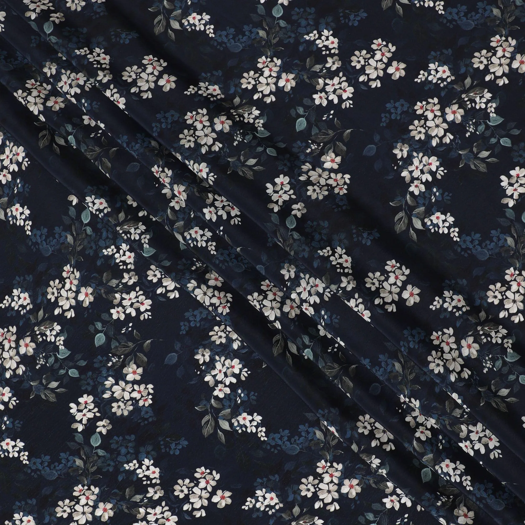Navy blue synthetic crepe fabric with white, light green and red digital prints in floral design-D15769